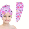 A pink and purple patterned microfiber hair drying towel wrap shown next to a child's face.
