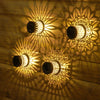 Solar-Mandala-Wandleuchte mit floraler Schattenprojektion
