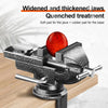 A close-up of a black clamp-on table vise with a red grinding wheel and various pads for the jaws.