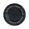 Black rotating engine start and stop button cover with decorative trim