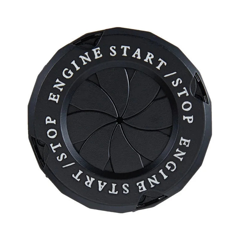 Black rotating engine start and stop button cover with decorative trim