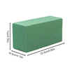 A rectangular block of green floral foam with dimensions 7cm x 2.76in by 10.5cm x 4.13in.
