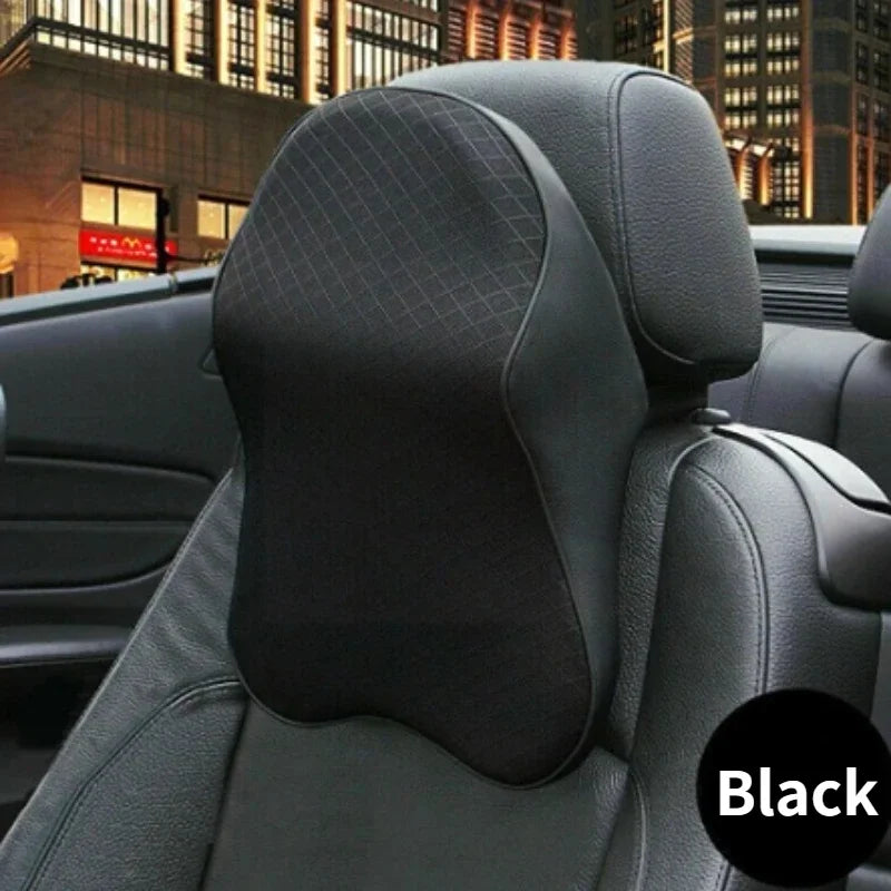 Black 3D memory foam car seat headrest pillow shown in a vehicle interior.