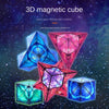 A colorful 3D magnetic cube puzzle with various geometric shapes and vibrant colors against a starry background.