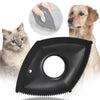 A black pet hair remover grooming comb is shown with a cat and a dog in the background.