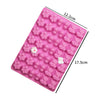 A pink silicone mold with various heart-shaped cavities for DIY candles, soap, and chocolate.