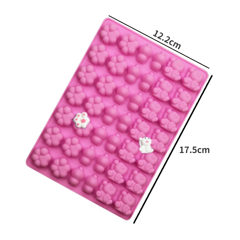 A pink silicone mold with various heart-shaped cavities for DIY candles, soap, and chocolate.