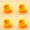 A bright yellow rubber duck toy is shown from above, with various sizes labeled for different numbers.