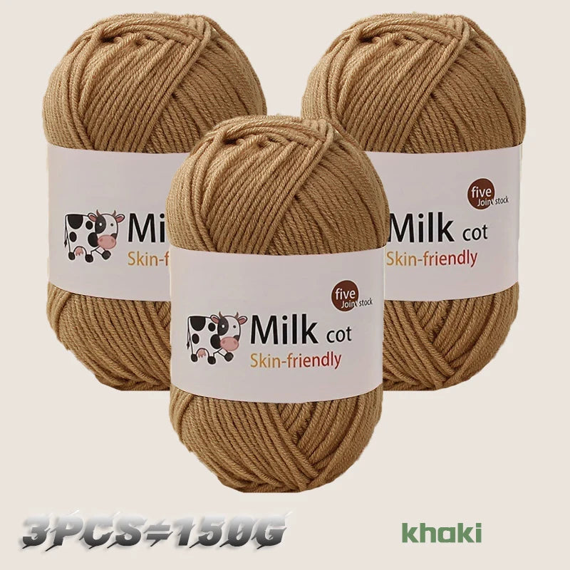 Three skeins of khaki colored Milk cot skin-friendly yarn for knitting and crochet projects.