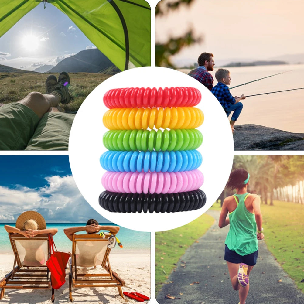 A collection of ten colorful silicone bracelets for mosquito repellent, stacked in various shades of red, yellow, green, blue