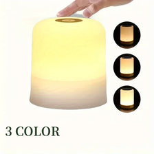 A hand is interacting with a glowing LED night light, showing three different color modes.