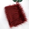 A swatch of deep reddish-brown faux fur fabric used for DIY sewing, doll hair, or cosplay.