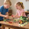 Two children play with a 46-piece dinosaur figurine set and storage box on a wooden table.