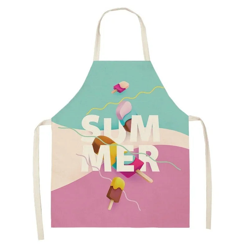A colorful linen kitchen apron featuring illustrations of ice cream cones on a teal background.