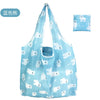 Light blue reusable shopping tote bag featuring a pattern of white cartoon bears.