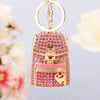 Gold and pink crystal rhinestone handbag keychain with a circular loop.