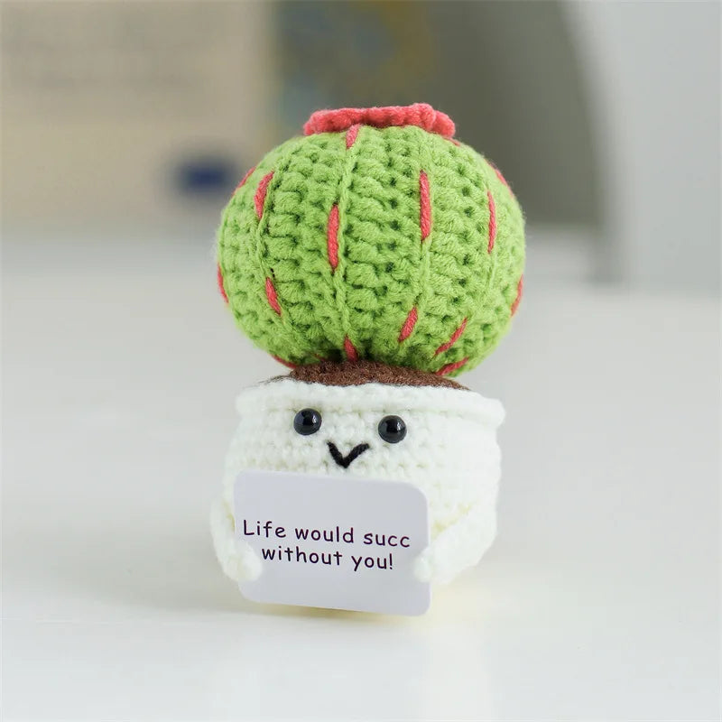 Handmade crochet positive energy doll shaped like a green cactus with a smiling face