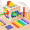 A wooden 5-in-1 Montessori shape and color sorting toy featuring various colored wooden shapes and a vehicle.