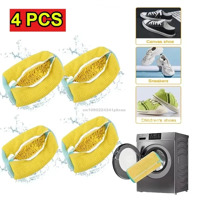 Four yellow canvas shoe laundry bags with bristled brushes shown next to a washing machine.