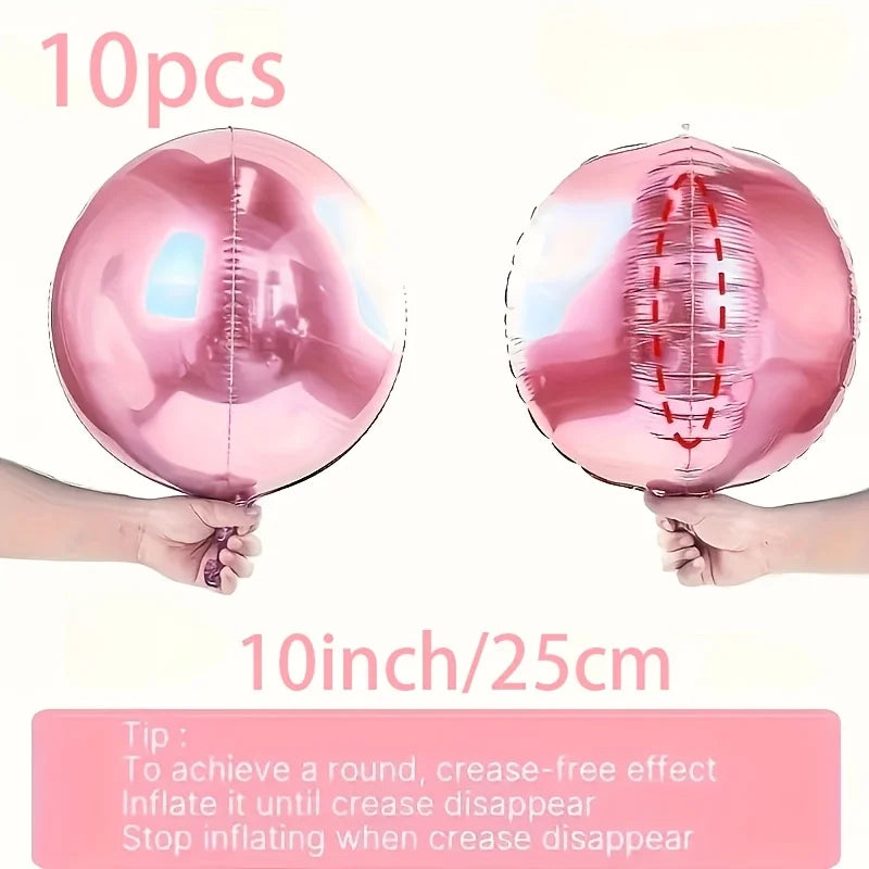 A set of ten metallic pink round foil balloons being held by hands, demonstrating the inflation and crease-free effect.