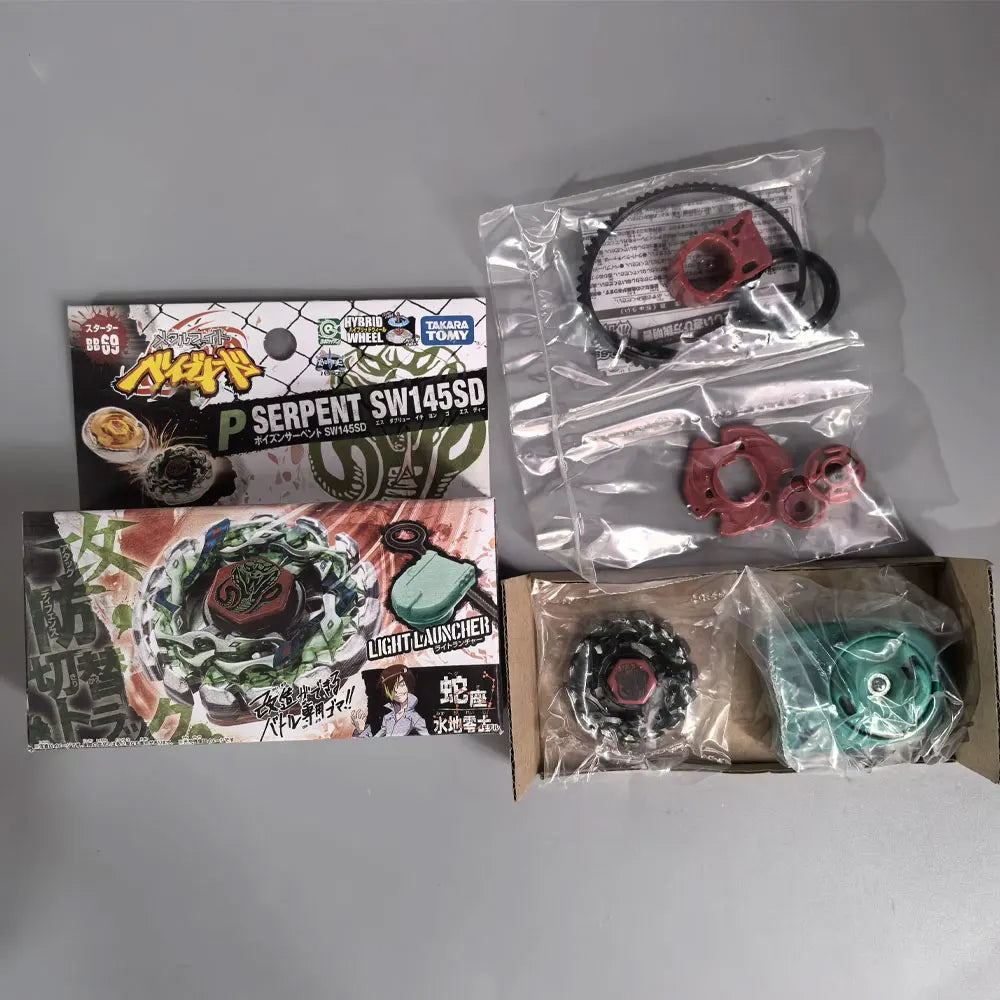 A set of metal spinning tops, including a purple and black top and a green top, packaged in plastic bags.