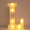 A glowing yellow LED letter night light shaped like the letter L, featuring multiple illuminated dots.
