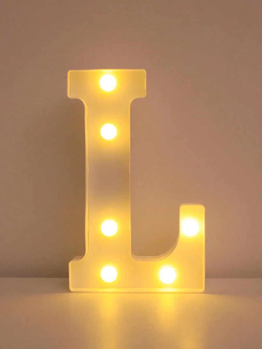 A glowing yellow LED letter night light shaped like the letter L, featuring multiple illuminated dots.