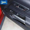 Carbon fiber grain decorative trim kit installed in a car interior door panel.