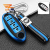 A blue TPU key fob cover with a black strap and silver clip is shown on a dark surface.