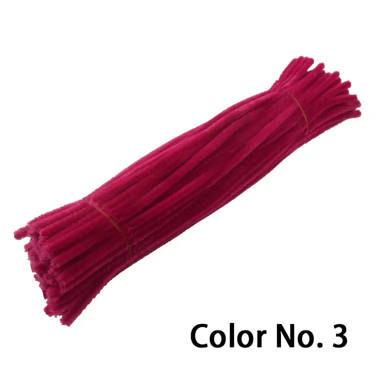 A vibrant magenta chenille craft stem with a fuzzy texture.