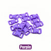 A pile of purple plastic side-release buckles for paracord bracelet projects.