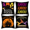 Un juego de cuatro fundas de almohada negras con diseños de Halloween, incluyendo un fantasma morado, un monstruo naranja y u