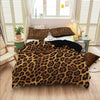 Brown leopard print duvet cover set with pillowcases displayed on a bed in a bright room.