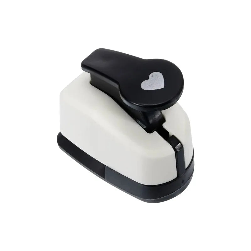 A black and white heart-shaped paper punch set for crafting.