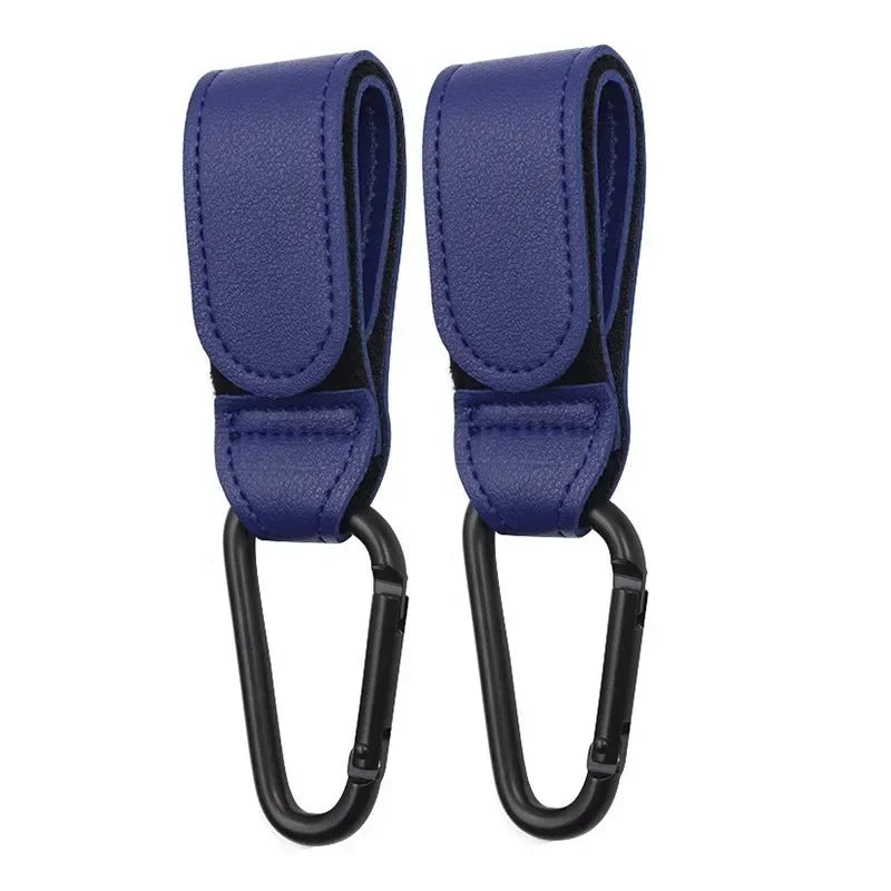 A pair of navy blue PU leather stroller hooks with swivel bags for organizing strollers and prams.