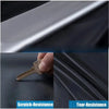 Close-up of a metal key and a dark fabric showing scratch and tear resistance features.