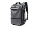 A gray expandable travel laptop backpack with black straps and compression features.