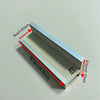 A portable fingerboard ramp set featuring a quarter pipe and rail, shown in profile view.