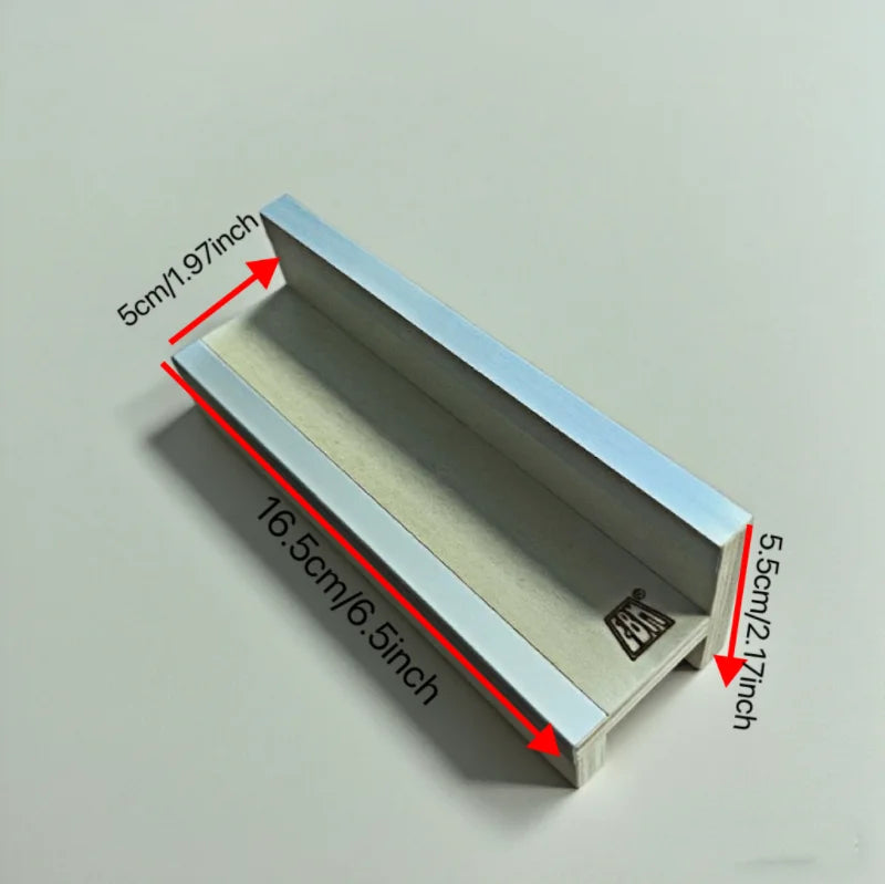 A portable fingerboard ramp set featuring a quarter pipe and rail, shown in profile view.