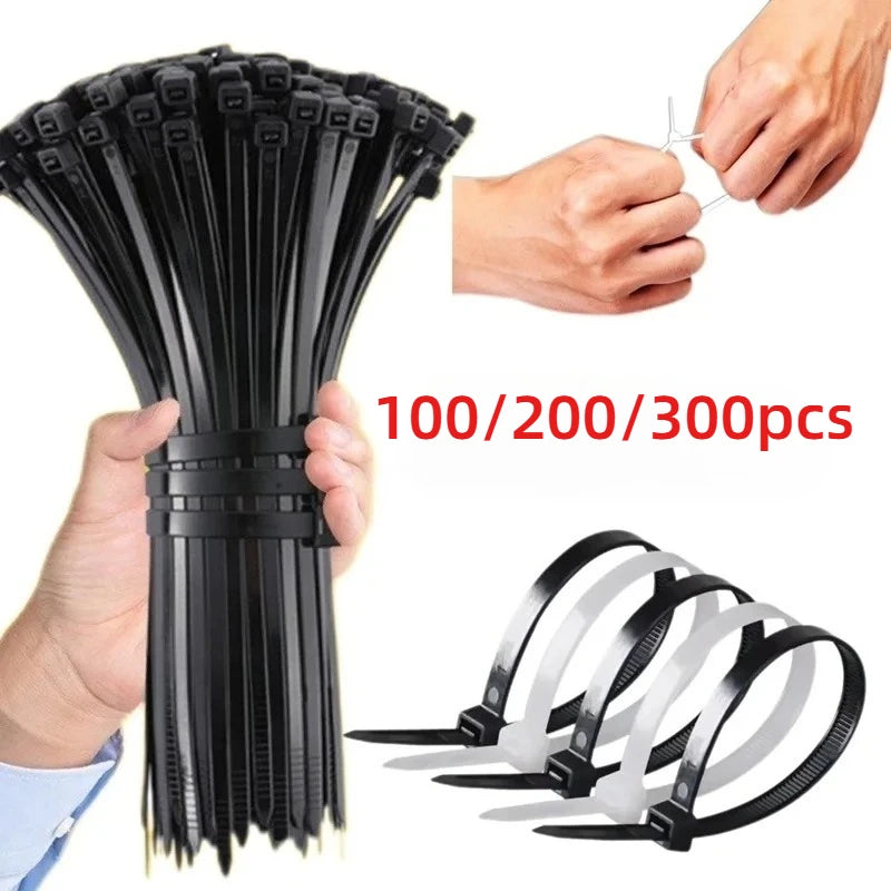 A hand holds a bundle of black heavy-duty self-locking nylon cable ties with individual ties displayed below.