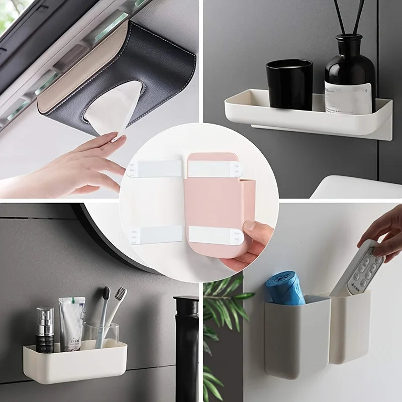 A hand is shown placing removable adhesive picture hanging strips into a white storage container.