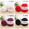 Five colors of luxurious cashmere blend fine yarn for knitting and crochet shown in skeins: white, red, purple, black, and ye