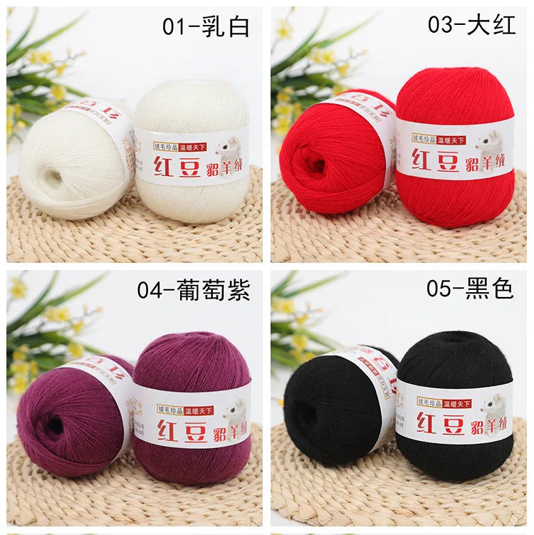 Five colors of luxurious cashmere blend fine yarn for knitting and crochet shown in skeins: white, red, purple, black, and ye