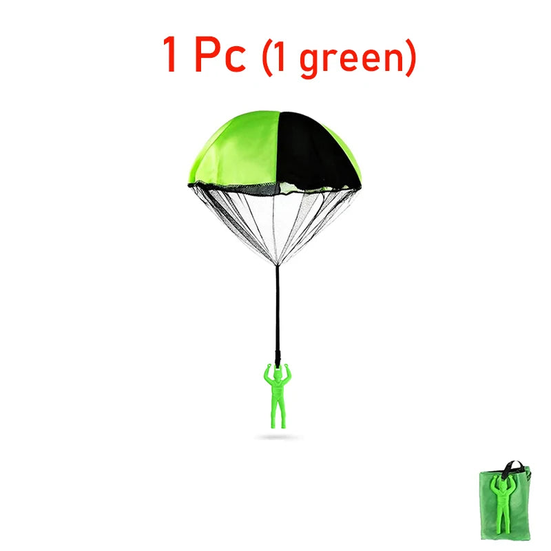 One green parachute toy with a black canopy and a small green figure underneath.