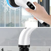 A hand is using a white electric spin scrubber with a blue head to clean a glass door, shown in close-up.