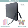 Black scrapbook album with a black ribbon and two colorful corner stickers