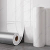 Roll of white marble peel-and-stick waterproof wall panels standing next to a vertical column.
