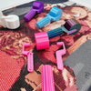 A collection of colorful, detachable diamond painting roller tools in various shades of purple, blue, pink, and green scatter