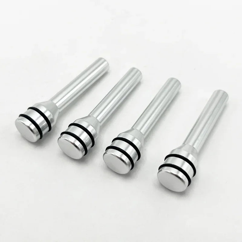 Four silver aluminum alloy car door lock pins with threaded ends.