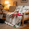 A cozy high-density short plush throw blanket featuring a woodland animal design draped over a light-colored sofa.